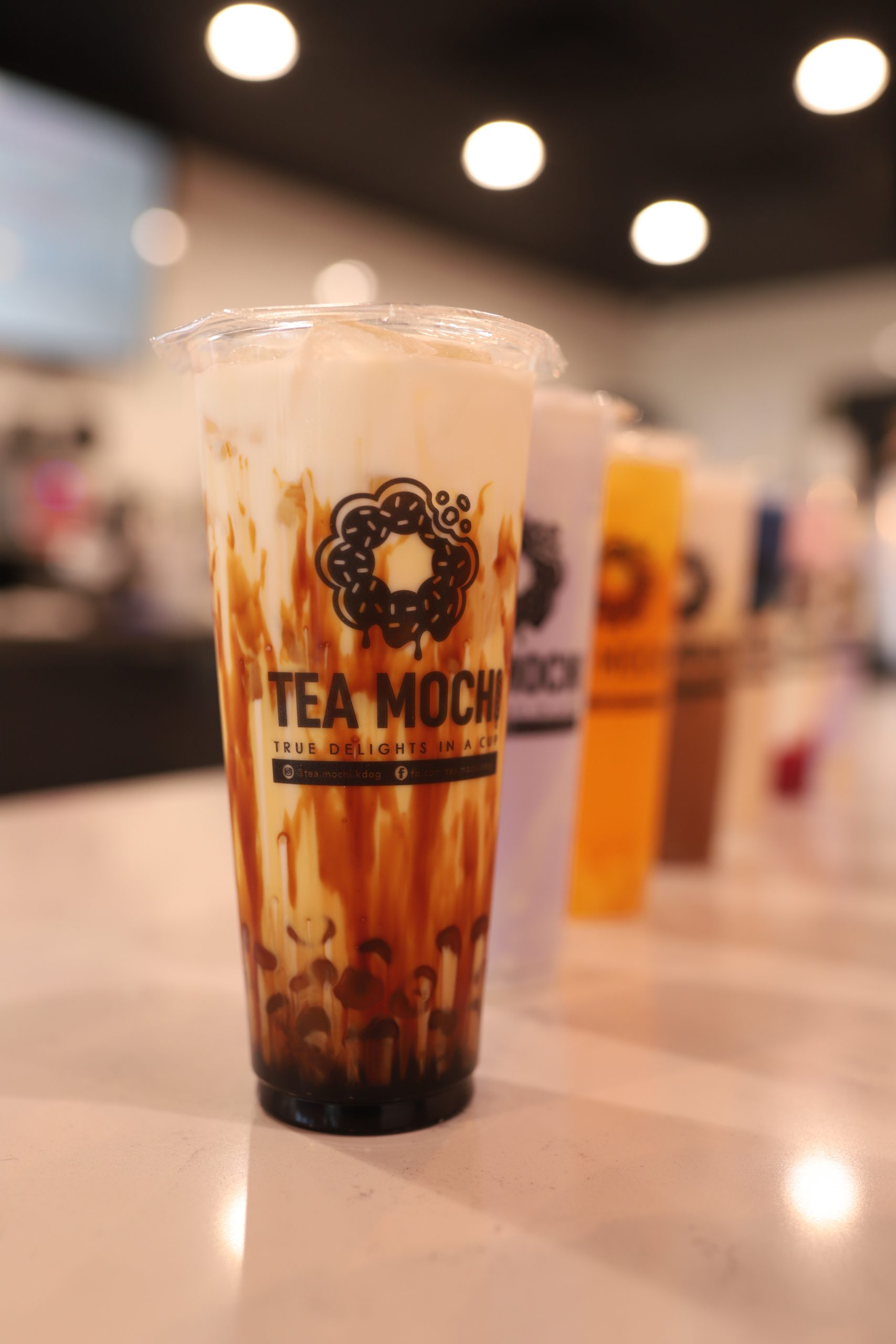 A set of Tea Mochi drinks lined up